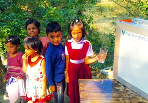 Children getting water from a Watersprint solar purification plant.: Thanks to an innovative energy-saving solar-based water purification technology, rural areas in Bangladesh are now able to access safe drinking water. Photo: K. M. Persson Published: 12/02/2016